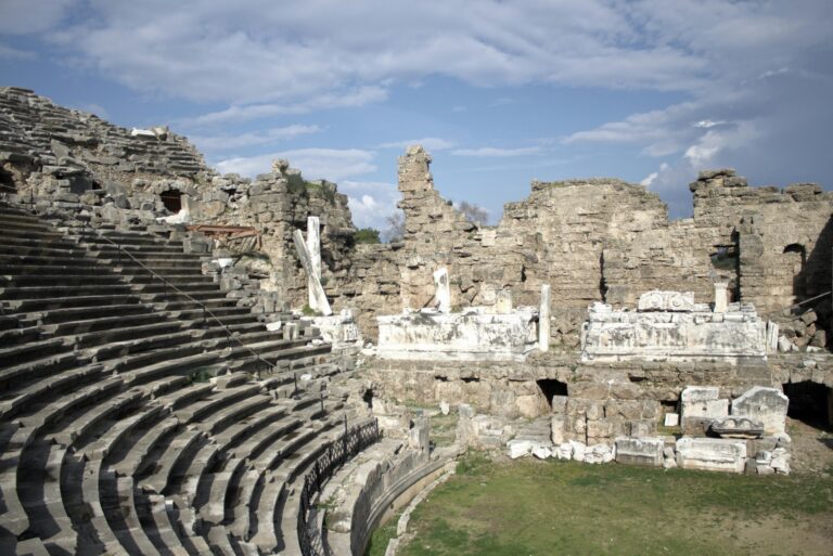 Photo of a stone amphitheater in ruins. Photo by Anton Etmanov on Unsplash.